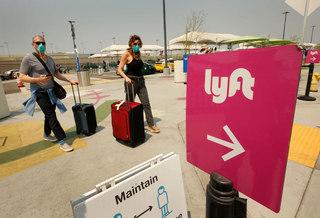 Uber and Lyft drivers with the Mobile Workers Alliance held a moving rally as part of a statewide day of action to demand that both ride-hailing companies follow California law and grant drivers basic employee rights and to denounce the corporations effort