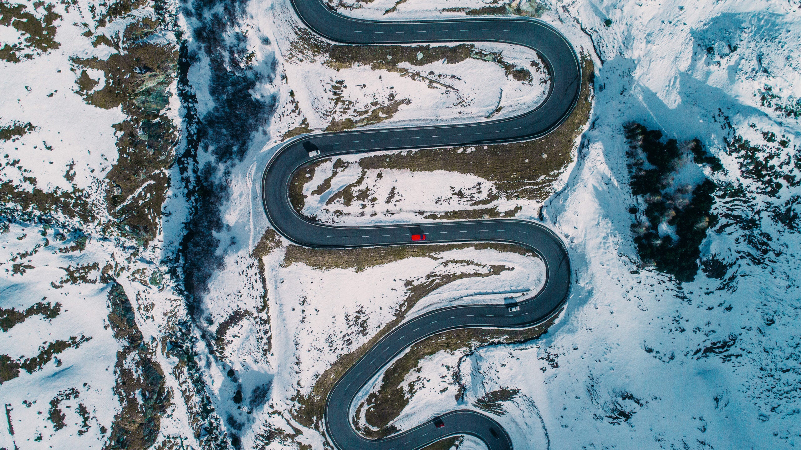 Aerial view of red car on Julier pass in Switzerland