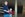 teenage boy and little boy standing in front of palm tree