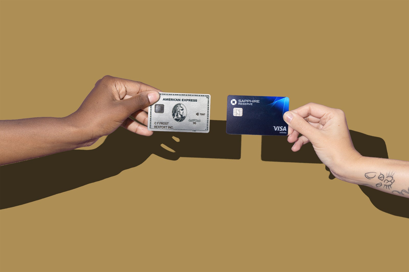 Hands holding credit cards