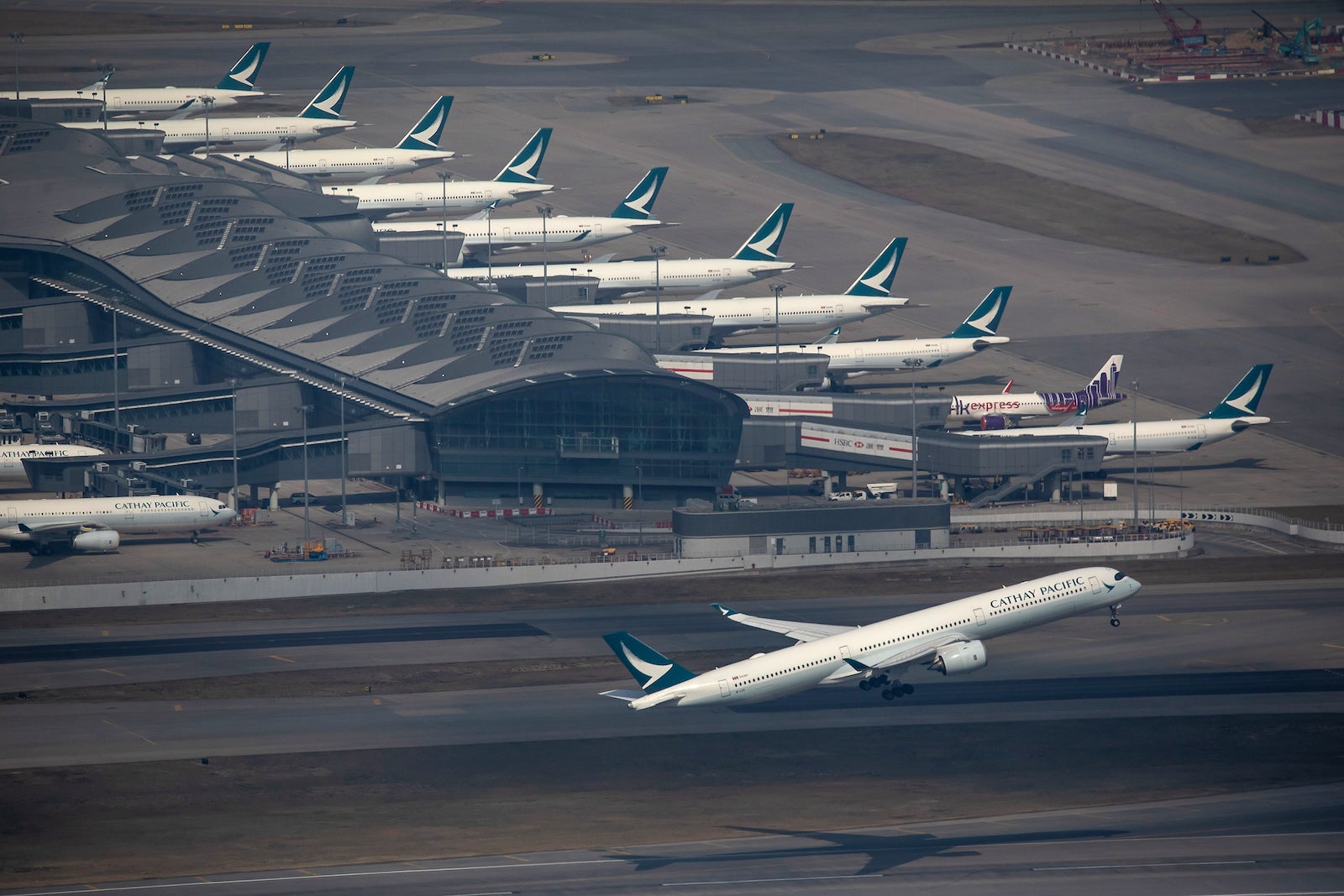 Aircraft at Hong Kong International Airport As Hong Kong Scraps Flights Amid Omicron