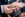 Person putting wedding ring on someone else