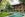 hotel with wooden features and pool