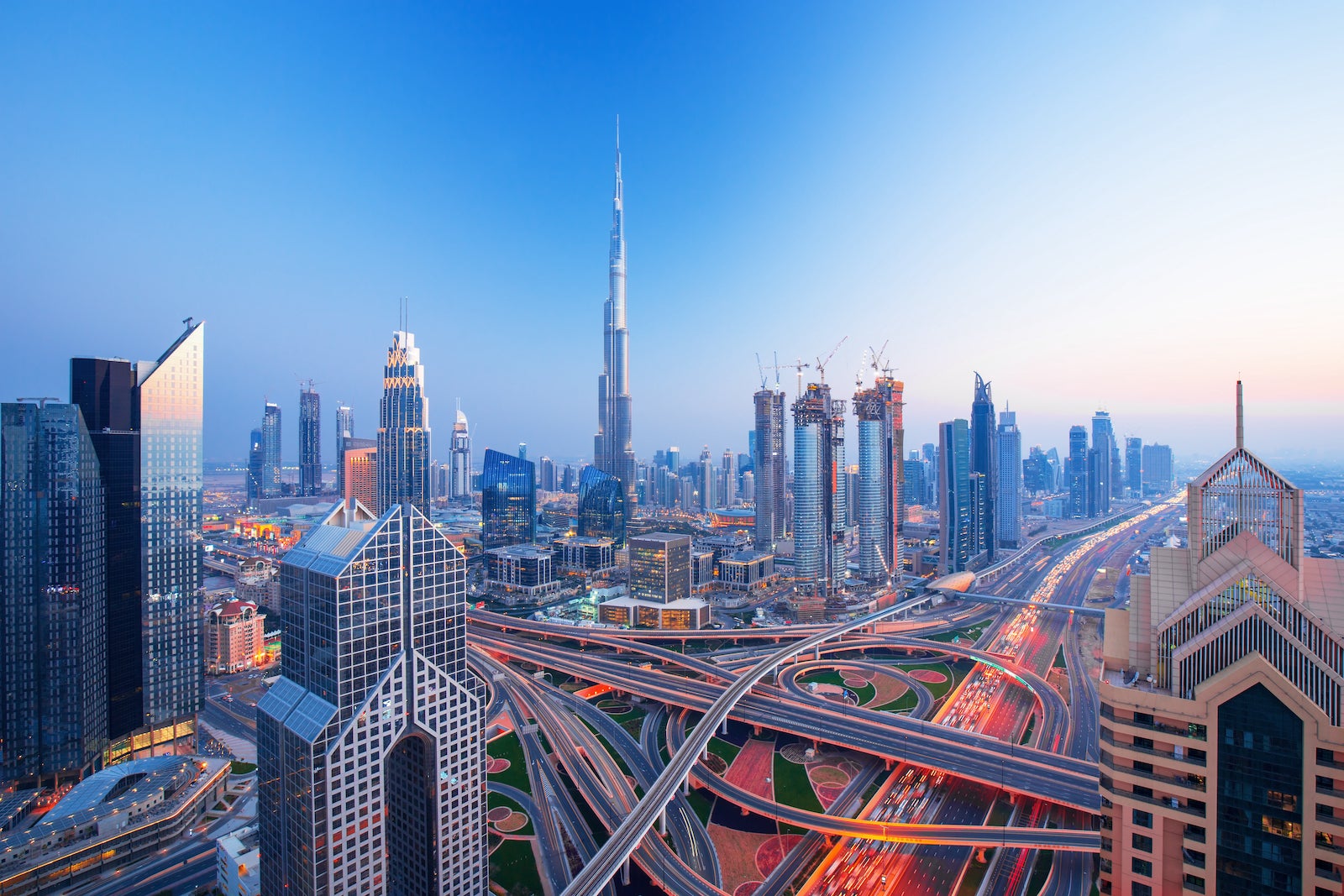 sunset view of the Dubai skyline with large interstate system