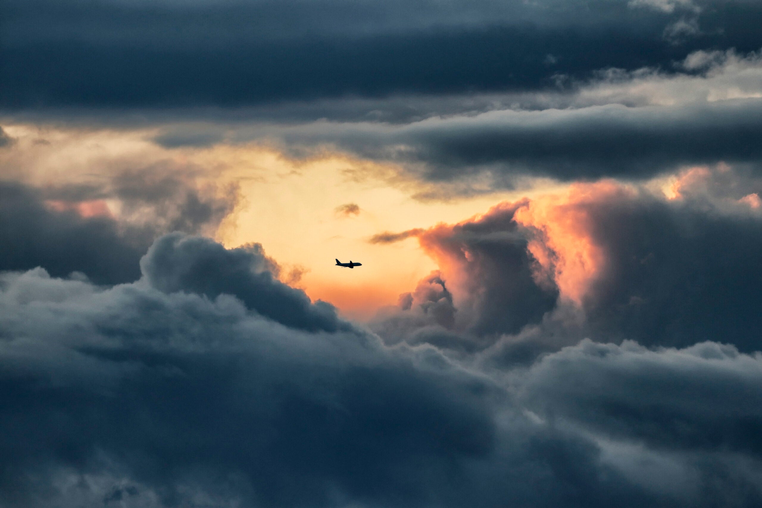 An airliner throughout stormy clouds in Normandy, France