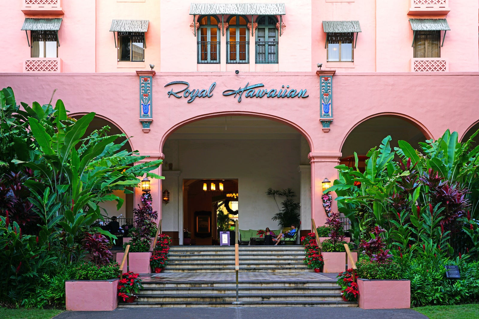 entrance steps to pink hotel