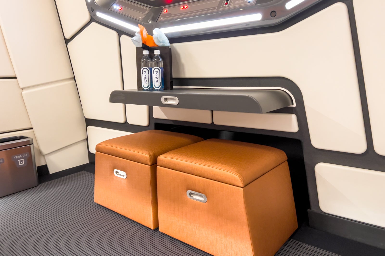 The pullout desk and stools in the Starcruiser cabin.