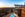 photo of hotel and pool overlooking mountains at dusk