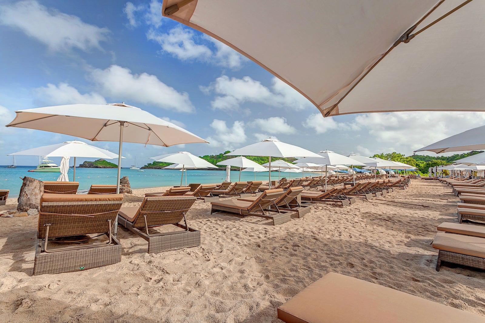beautiful beach with chairs, umbrellas and ocean