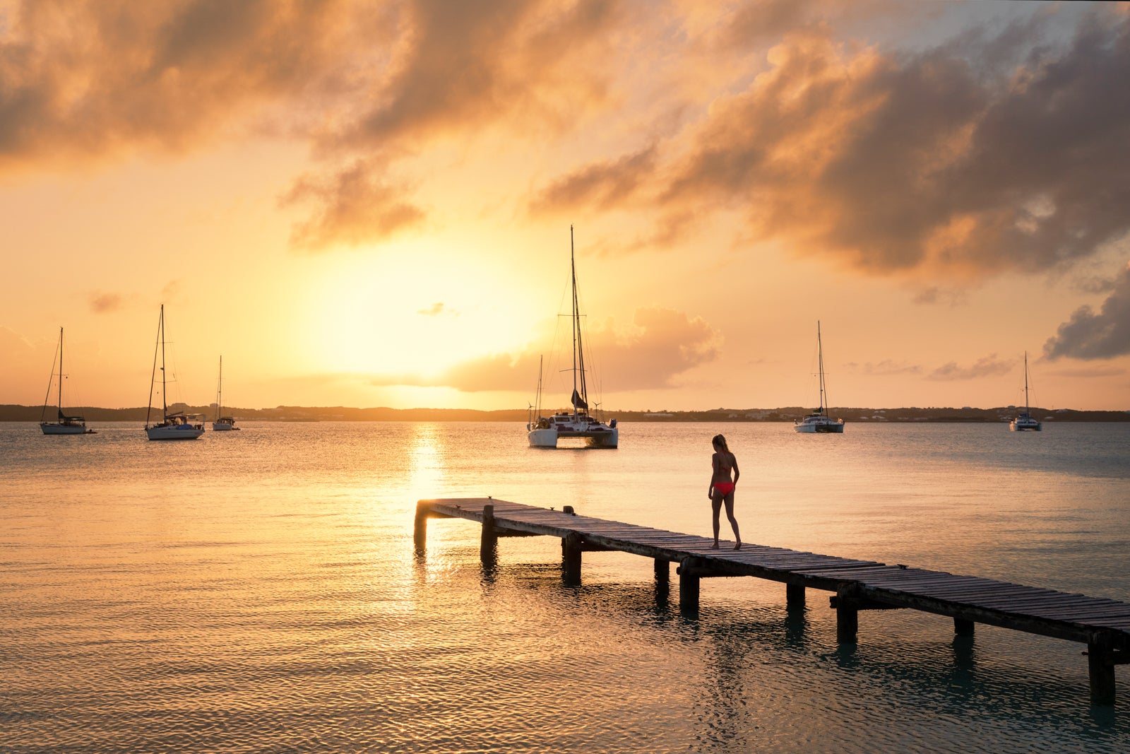 A girl walking on a dock_Stocking Island_Exumas_Bahamas