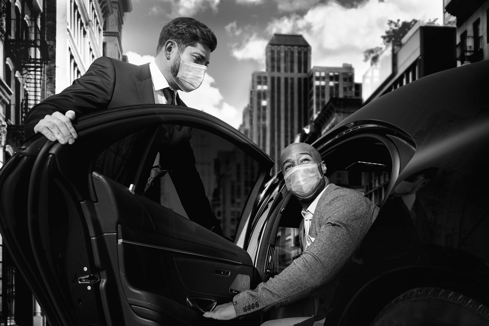 Chauffeur driver opens door for passenger