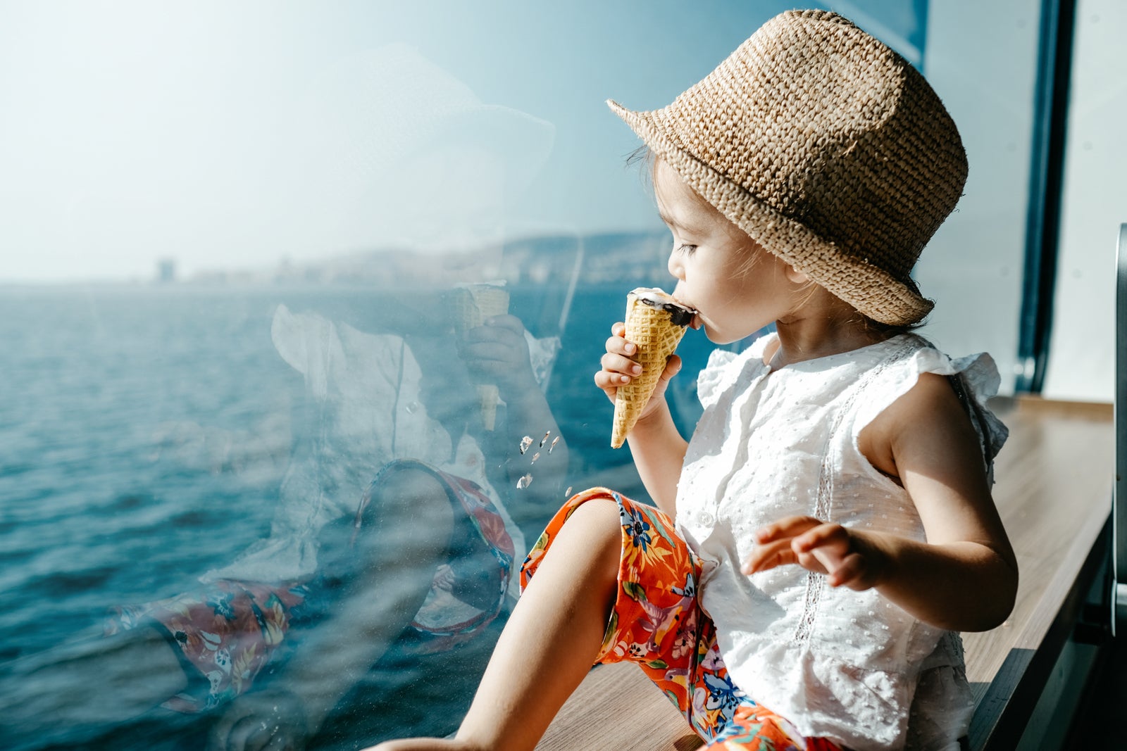 Little girls looking at the sea