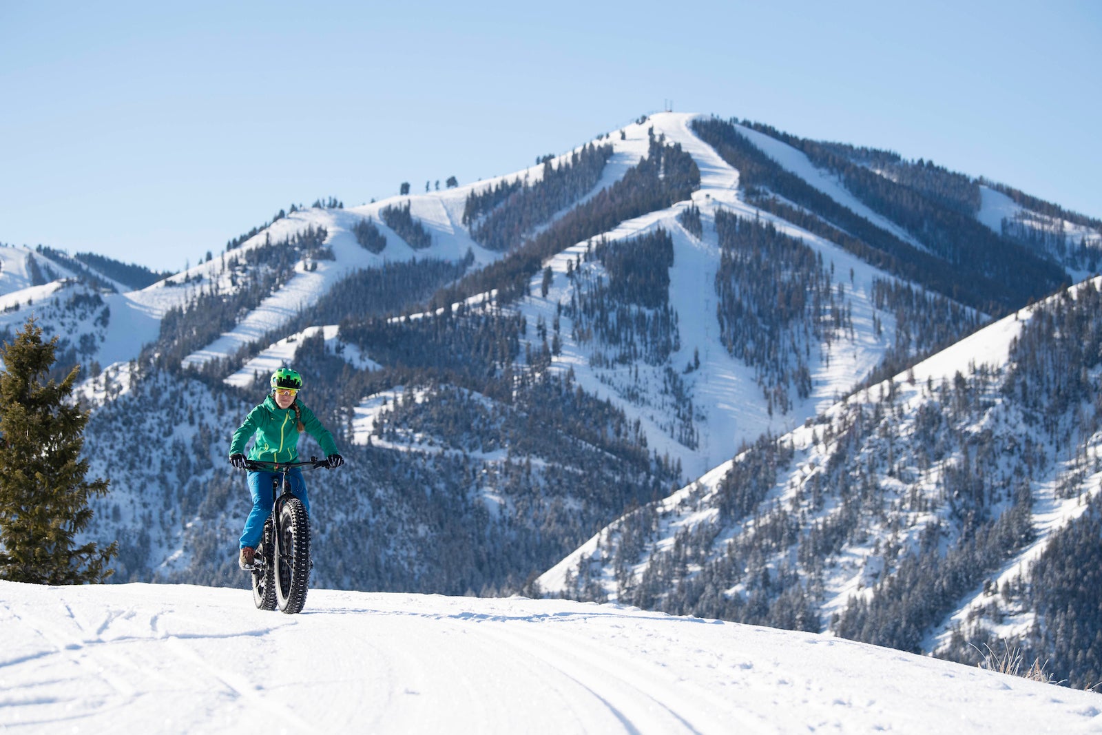 snow biking by mountain