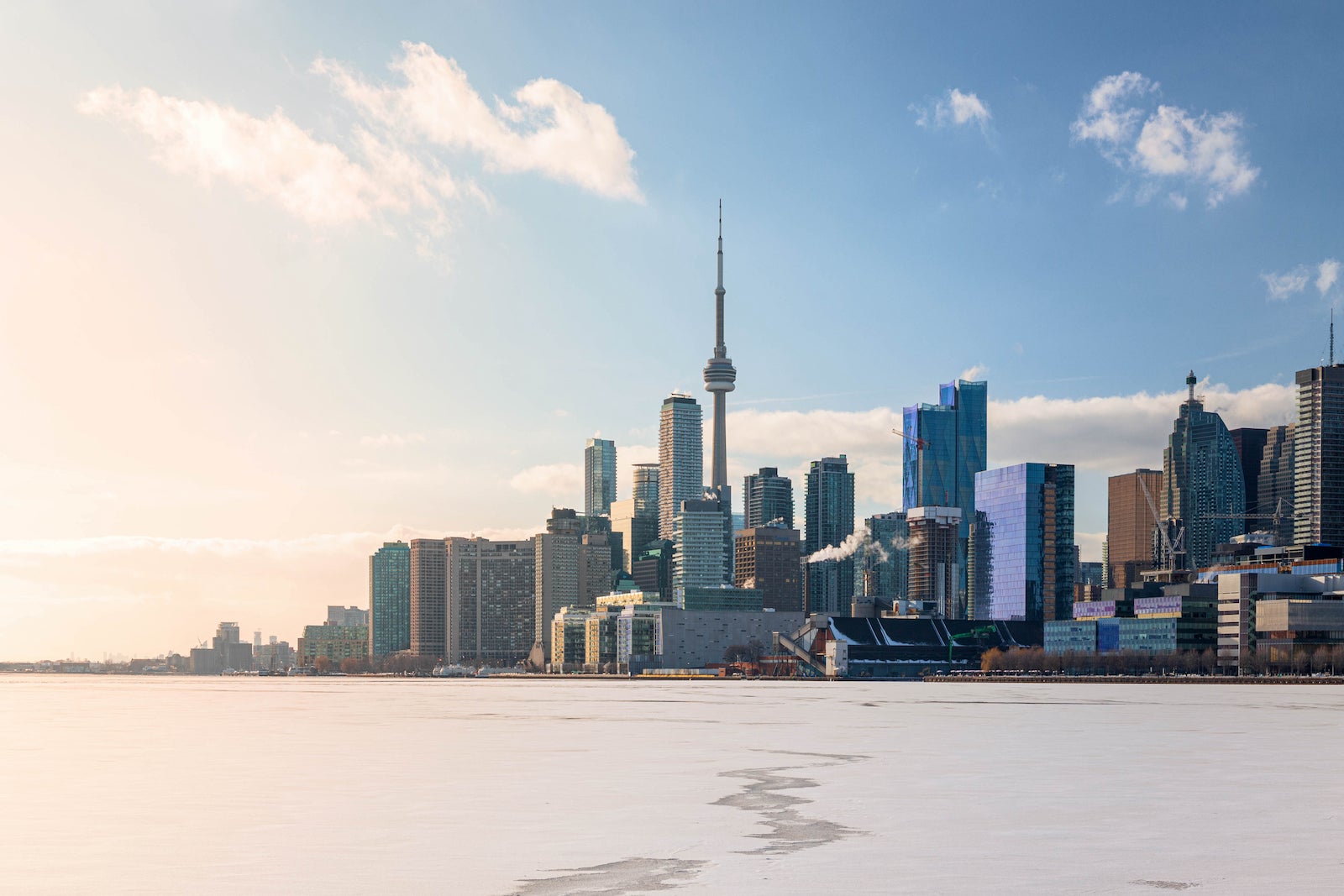 Toronto City Skyline on Sunny Winter Afternoon with Frozen Lake