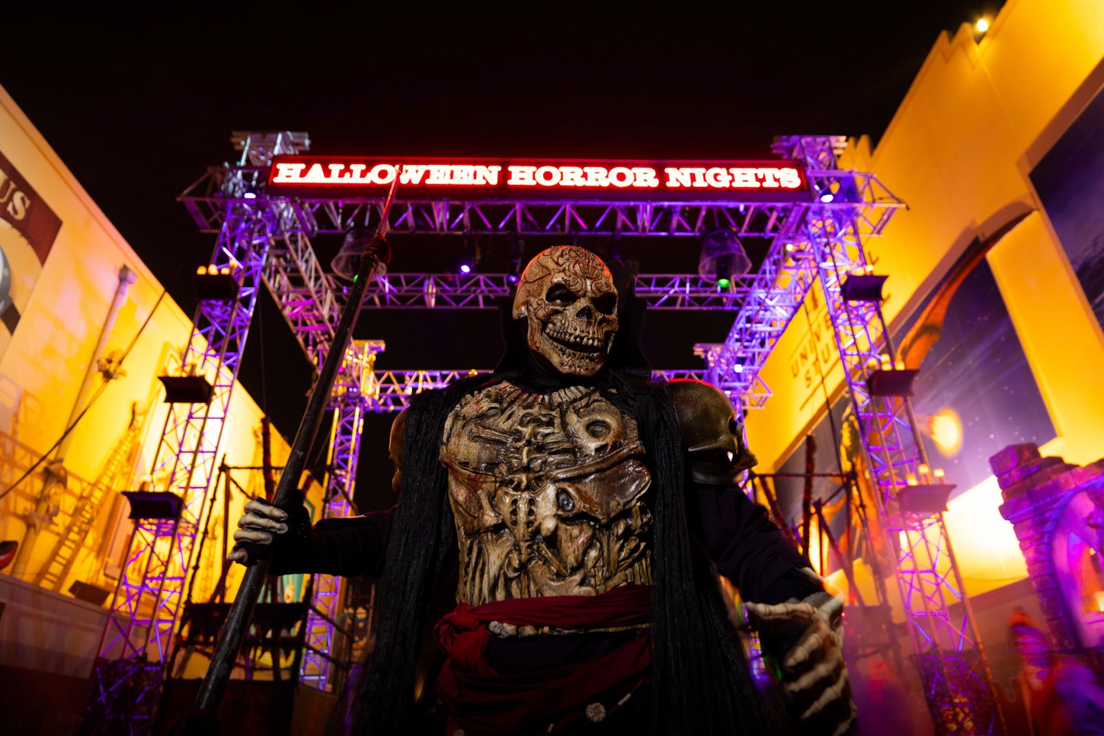 Skeleton in front of Halloween Horror Nights sign at Universal Orlando