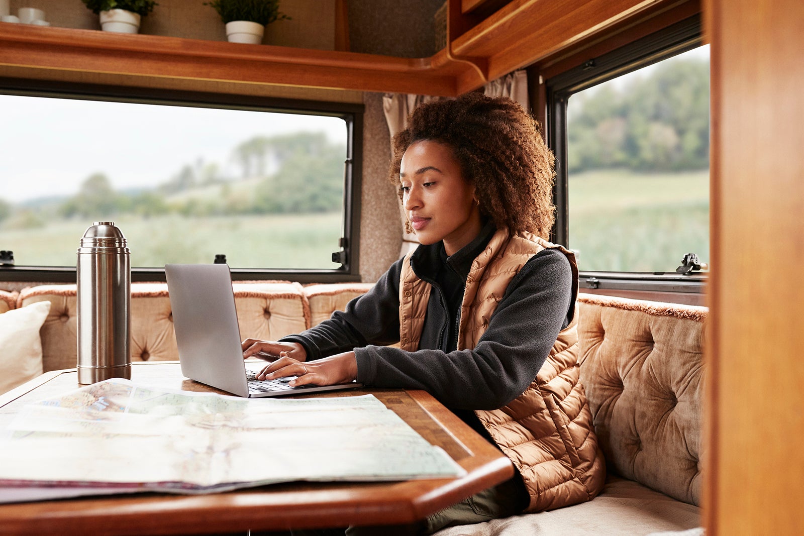 woman on laptop in an RV