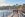 people in diving suites walking down pier