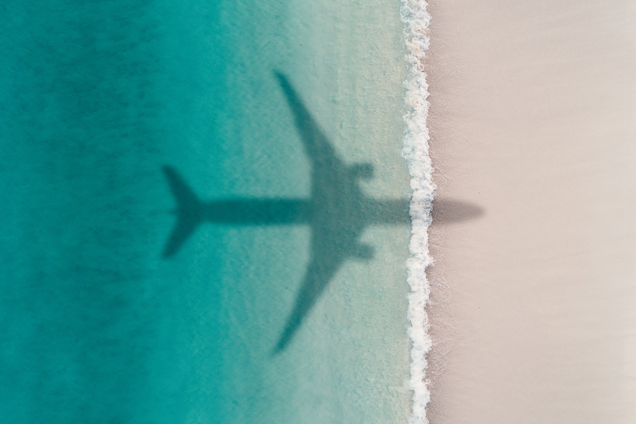 airplane over beach