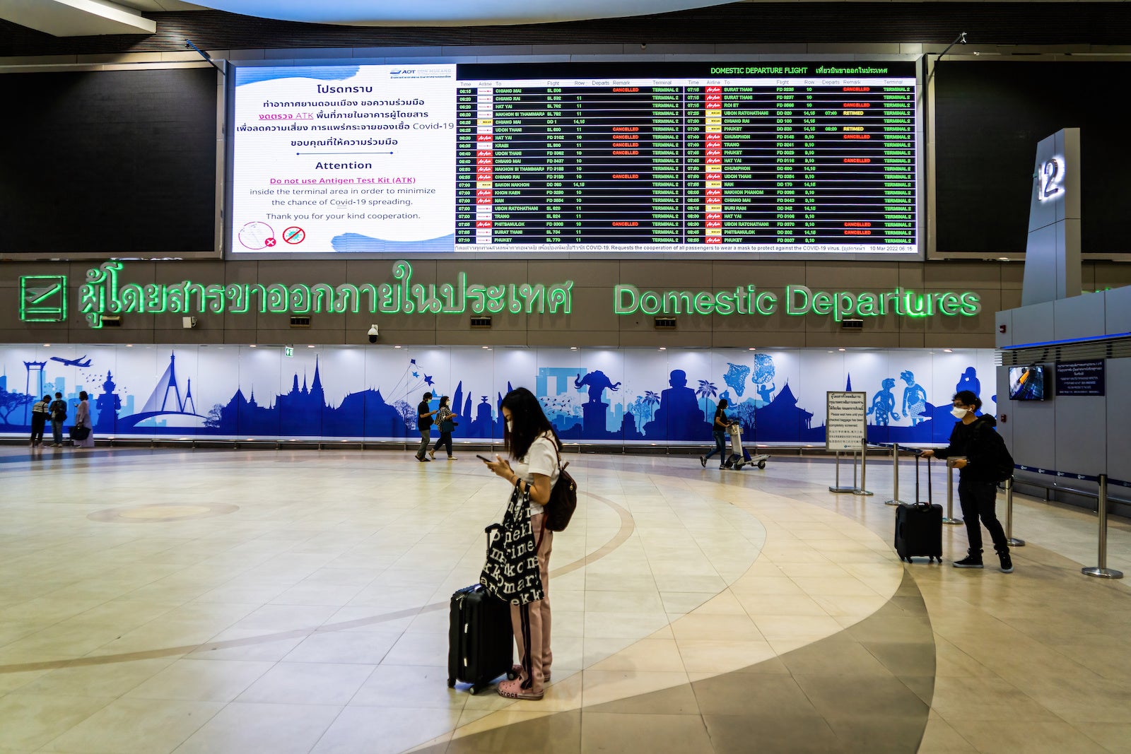 Passengers wait in the domestic departures hall at Don