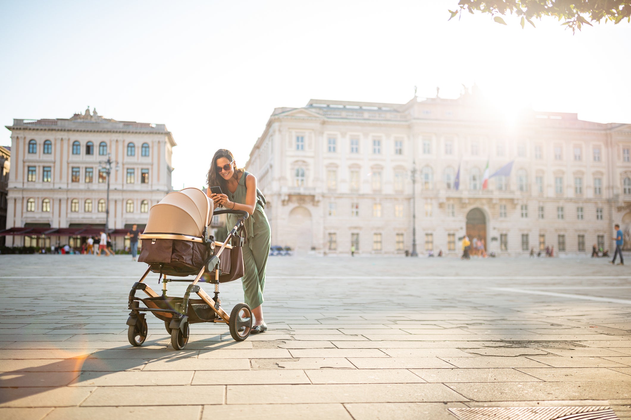 Young Italian woman walking with her baby