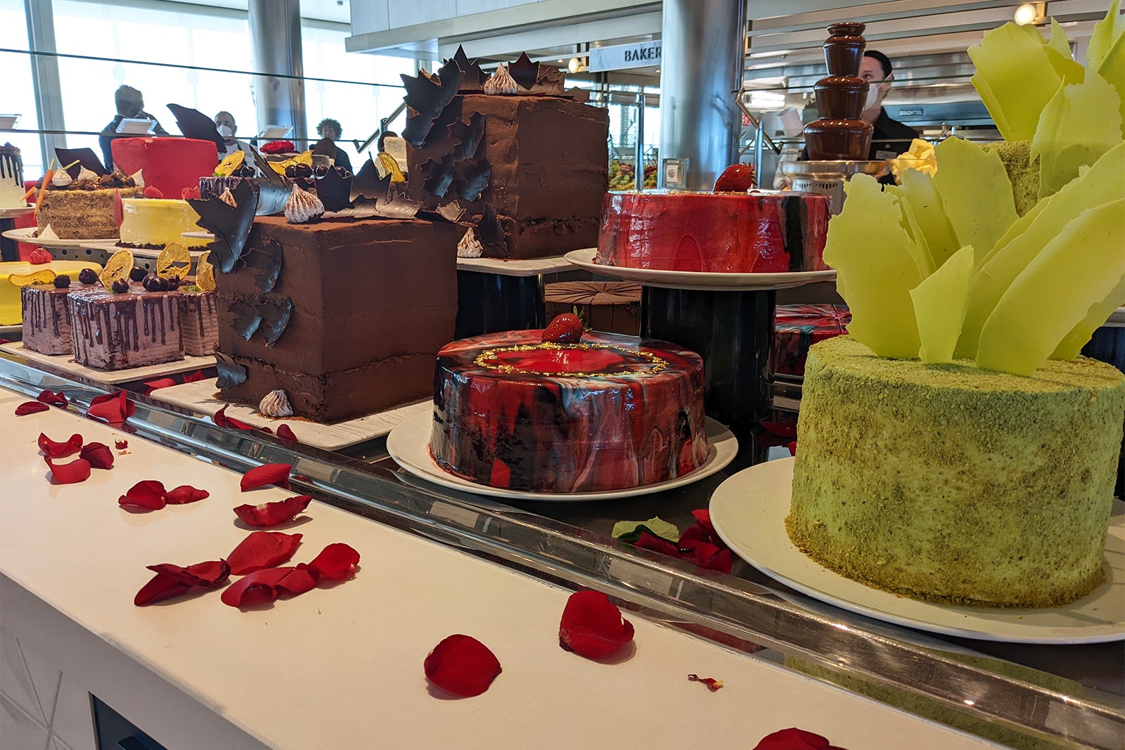 Fancy cakes in a row on a buffet counter