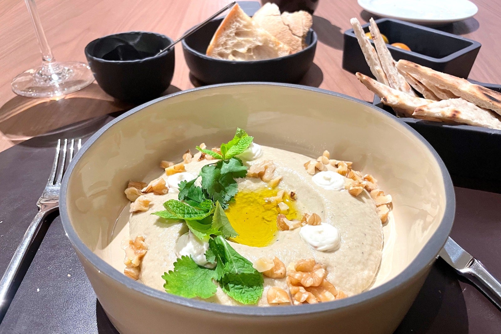 babaganoush in bowl with breads