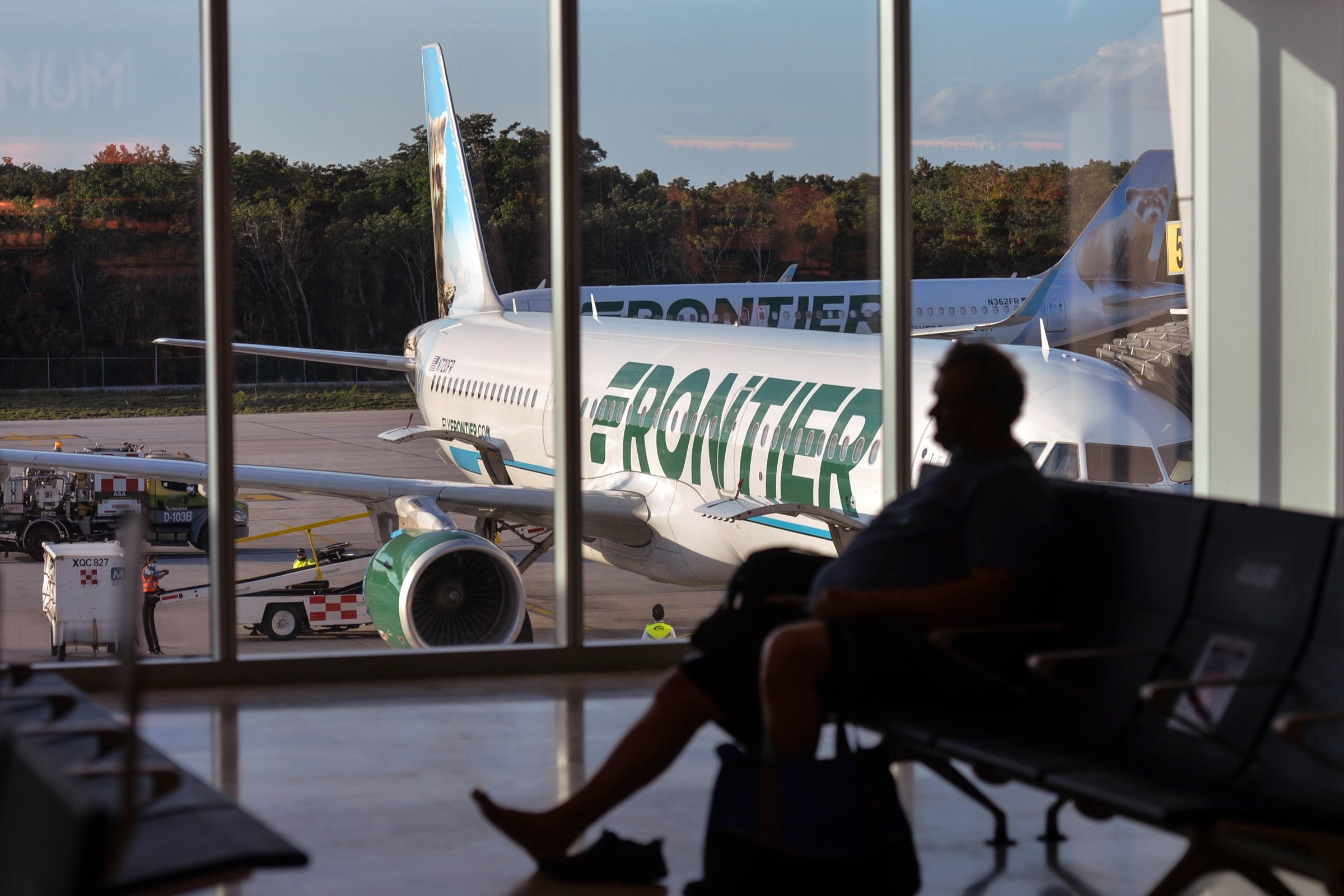 Frontier Airlines plane at the gate in Cancun