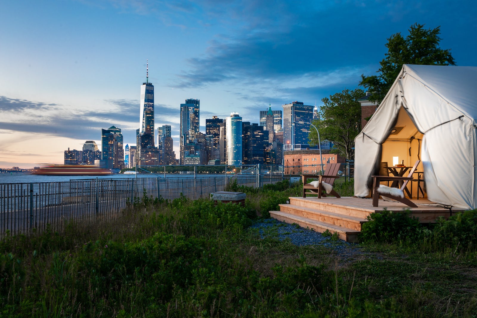 tent on island with NYC skyline in the distance
