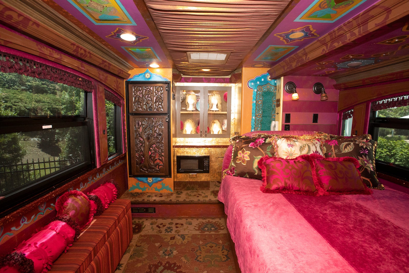 pink tour bus bedroom with wigs