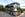 tour bus with dolly parton's signature in pink on side