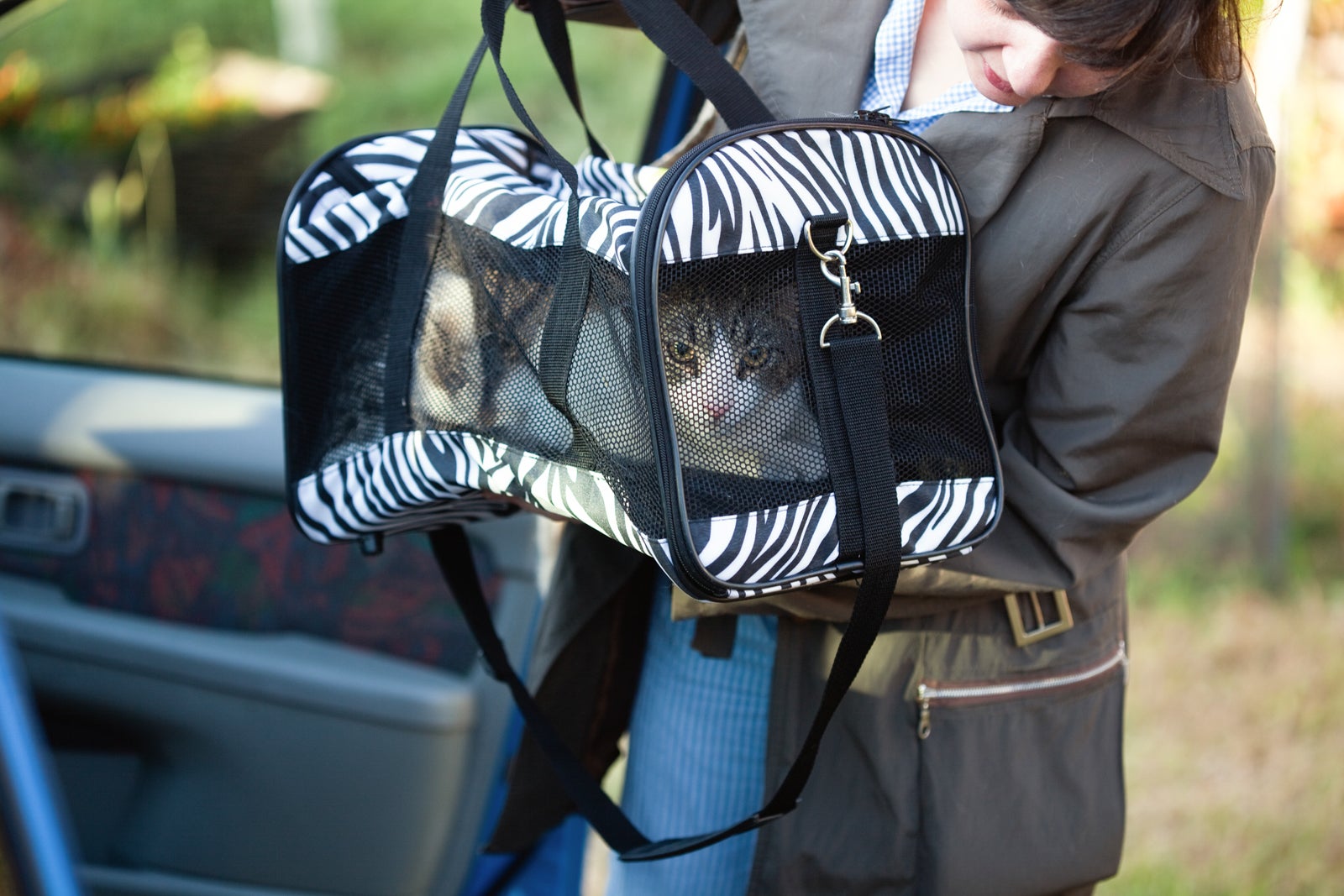 A woman with a pet carrier