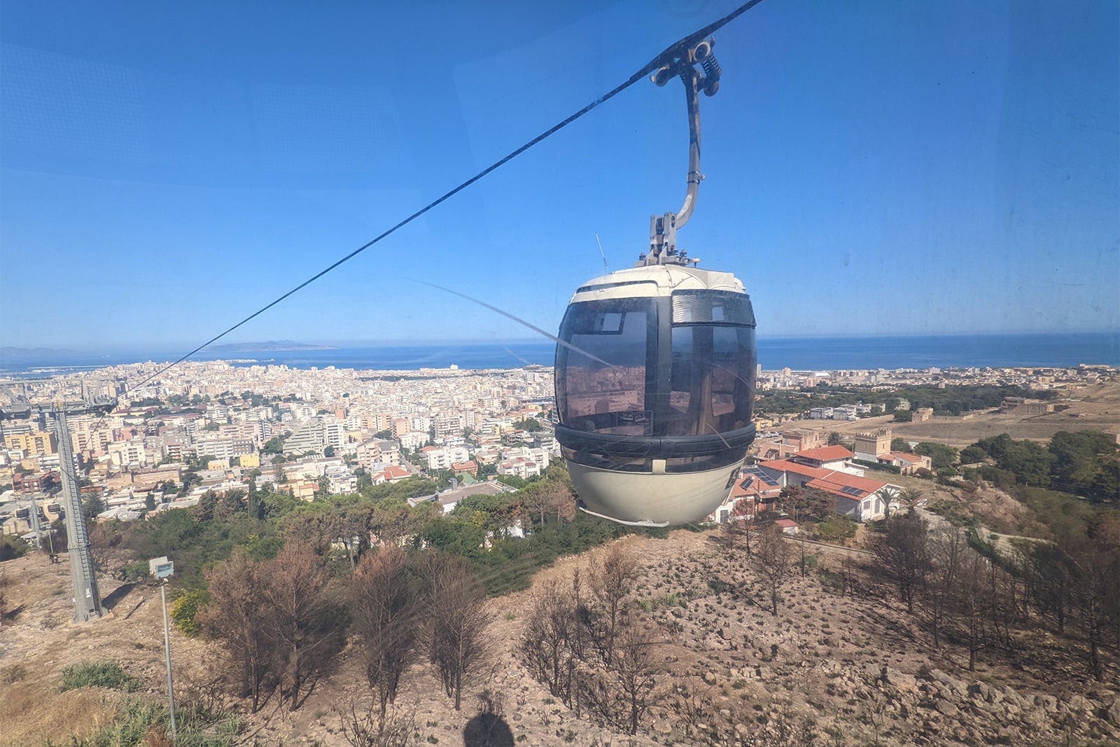 Cable car with sea views in the background in Italy