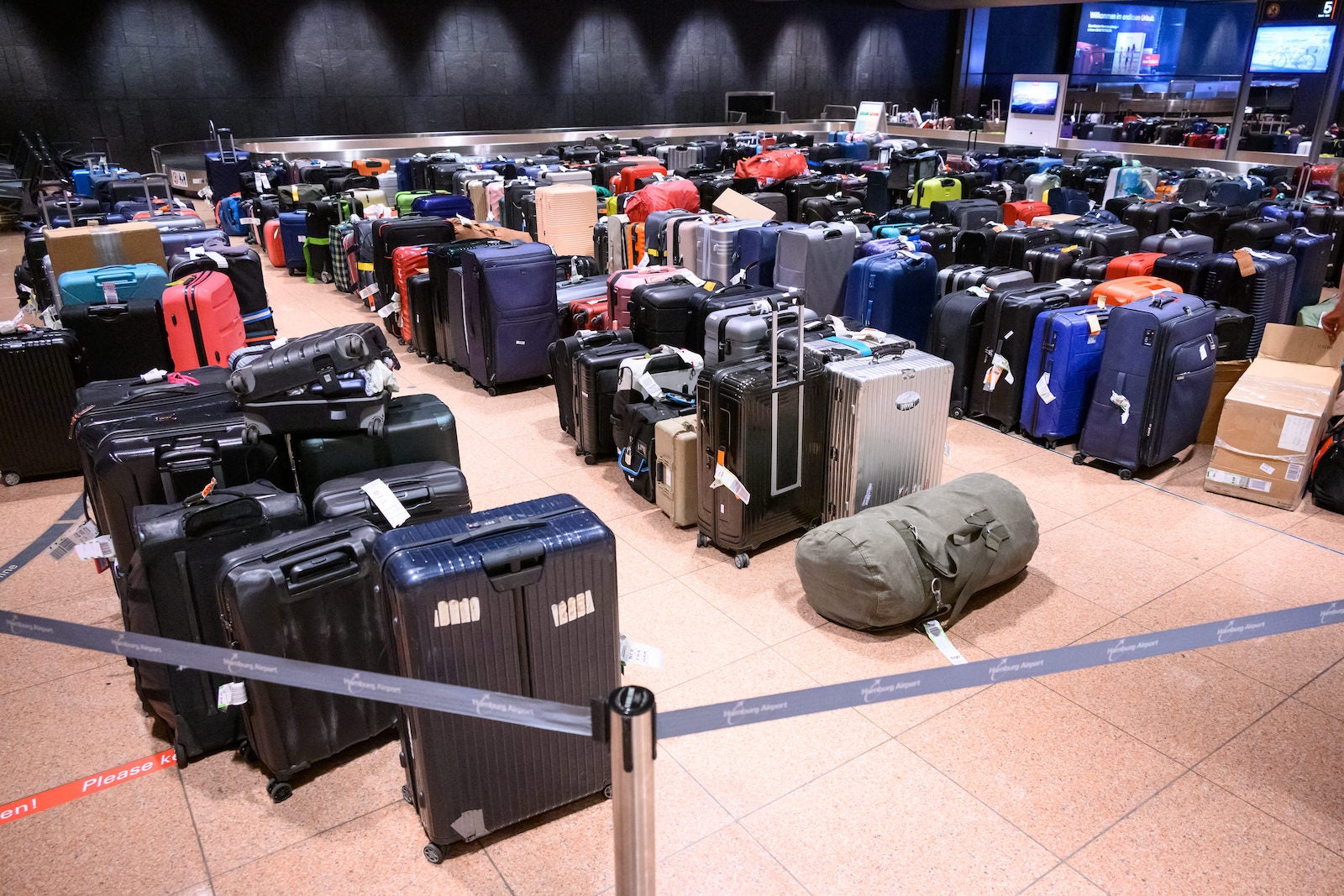 suitcases all over airport