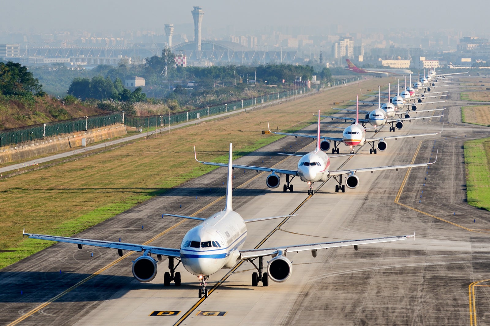 A large number of aircraft sliding in a line for take off in Chengdu Shuangliu International Airport，Sichuan，China
