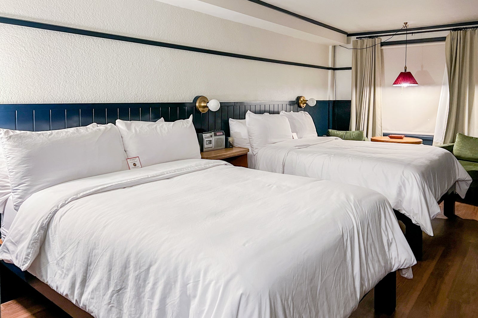Beds with white bedding in hotel room