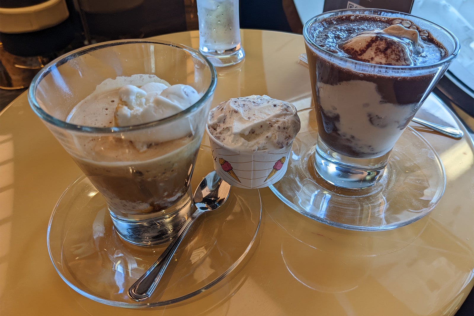 Coffee and hot chocolate affogatos and a small dish of ice cream