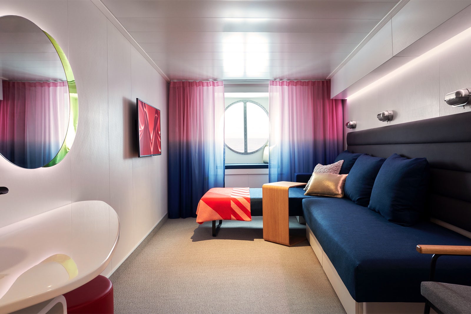 Cabin with porthole window on Virgin Voyages