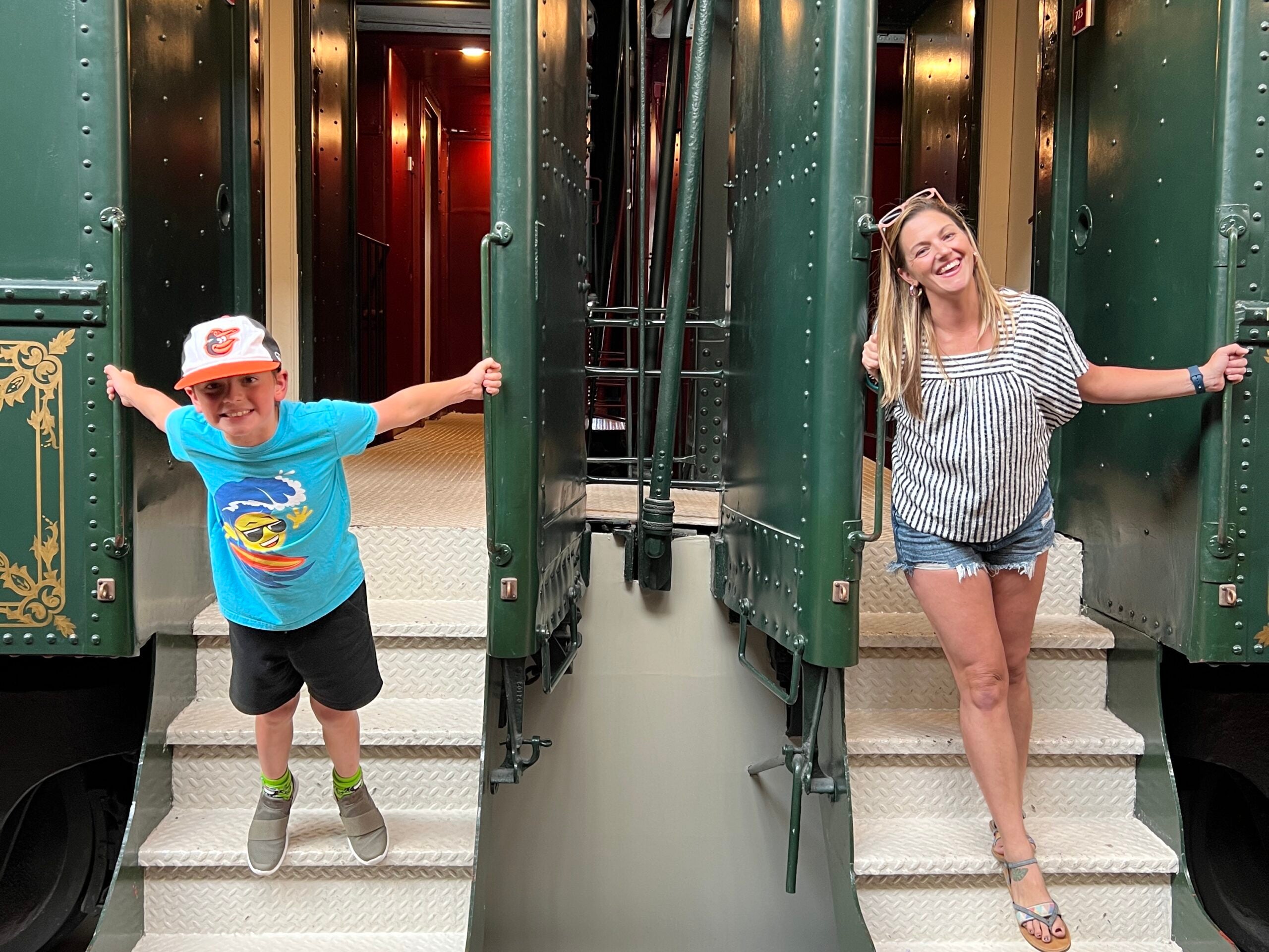 Tarah and her son on the train car steps