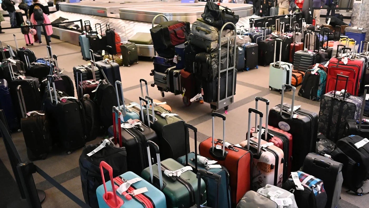 bags crowded together in airport