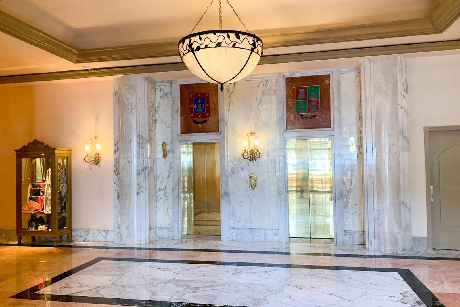 Hotel lobby with golden elevators