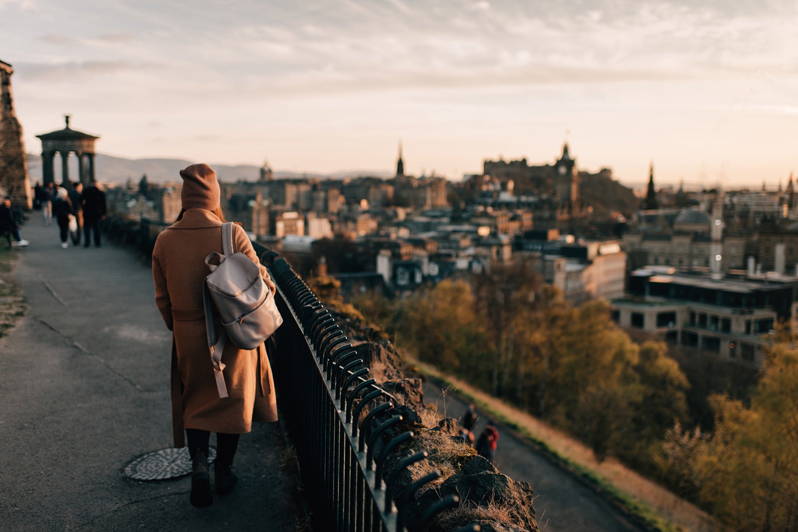 Woman enjoying view from Calton Hill, Edinburgh, Scotland