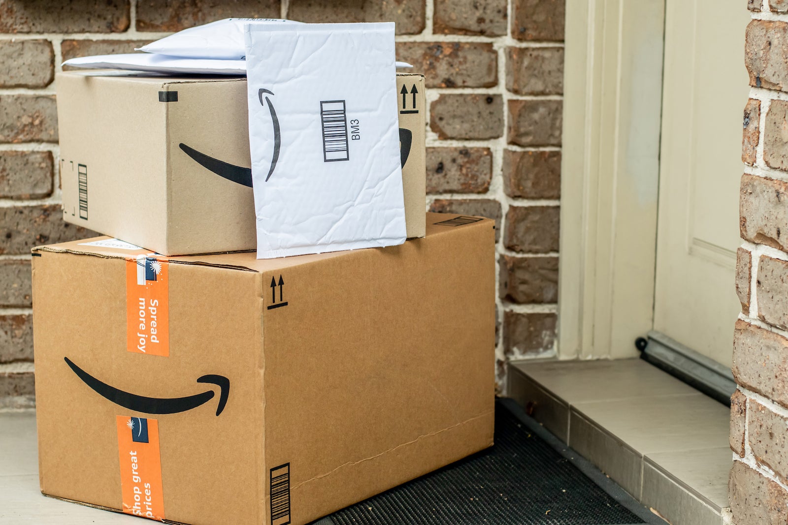 Amazon packages on a residential doorstep