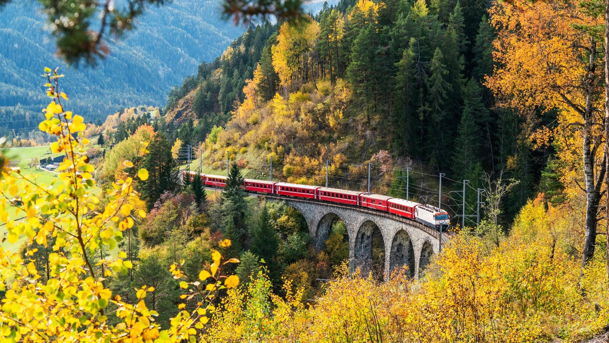 Bernina Express train in autumn, Filisur, Switzerland