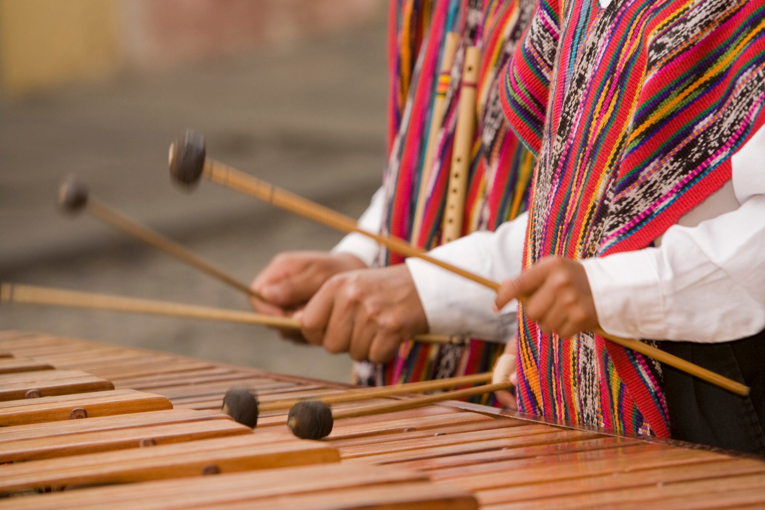 Hands of musicians playing marimba.