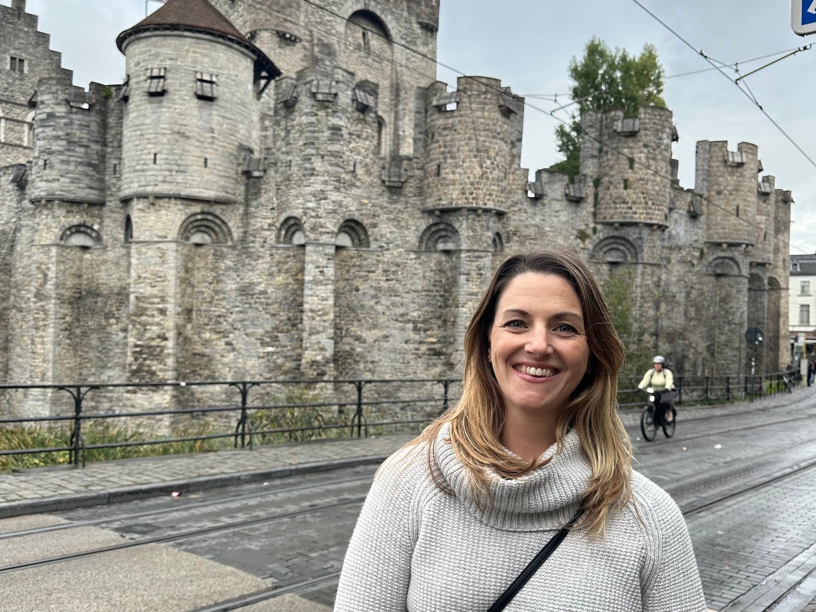 Woman standing outside castle in Ghent