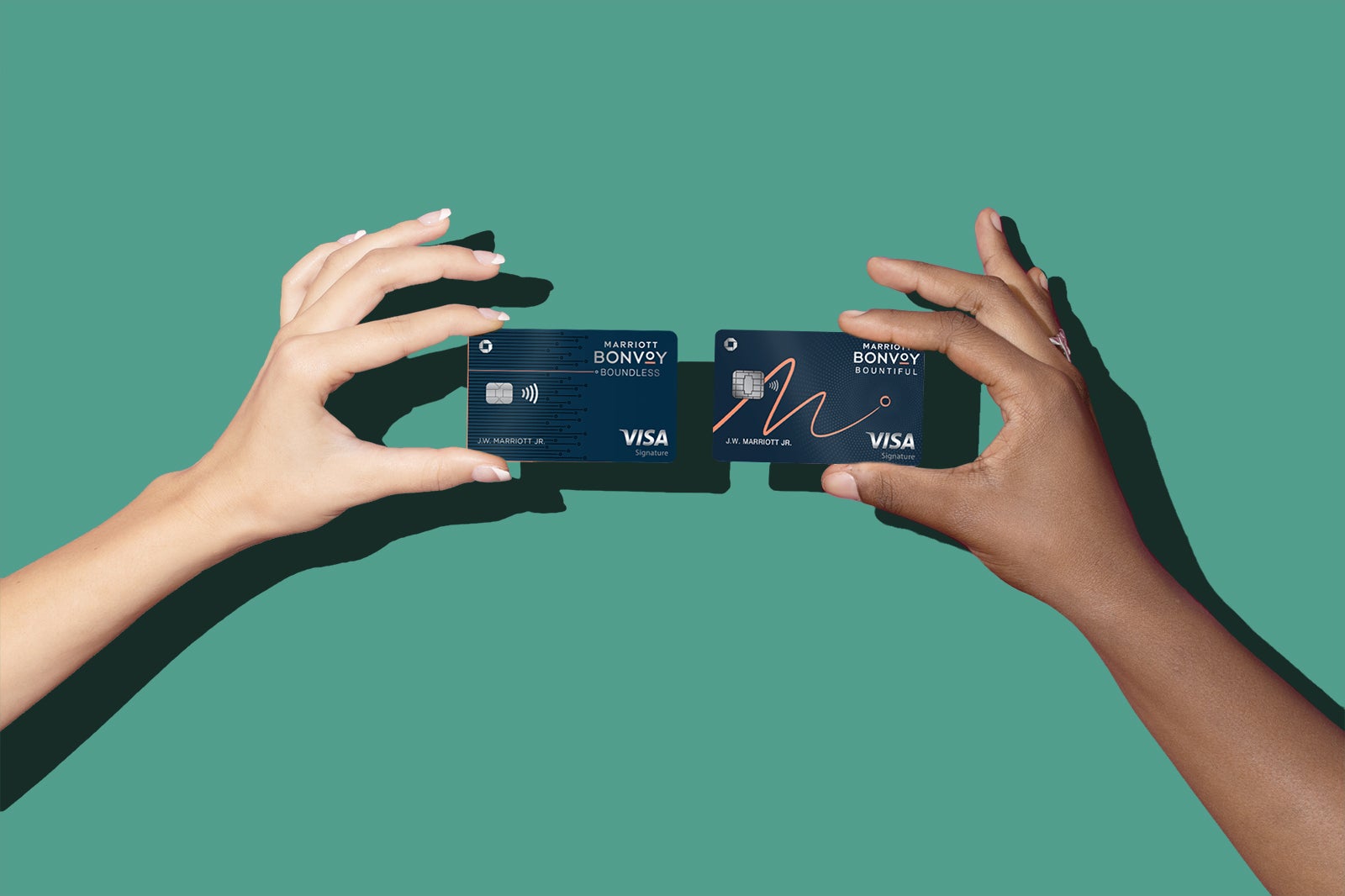 2 hands hold credit cards for a comparison