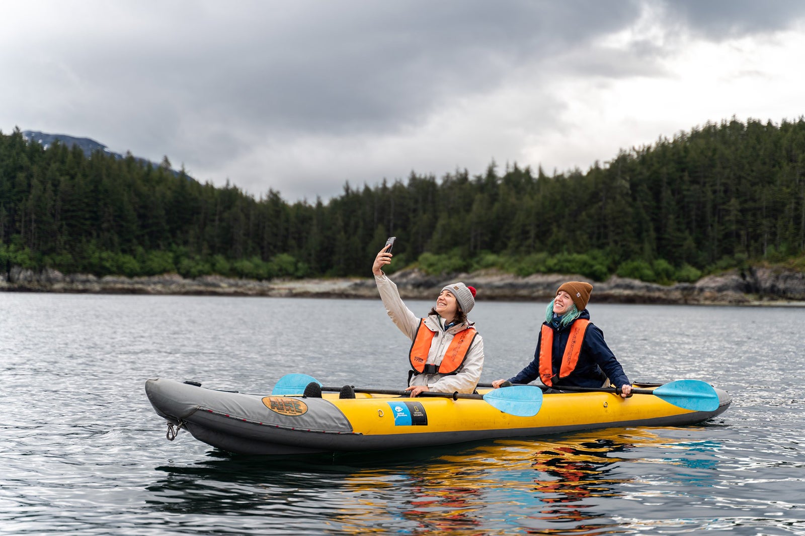 teens kayaking on lake