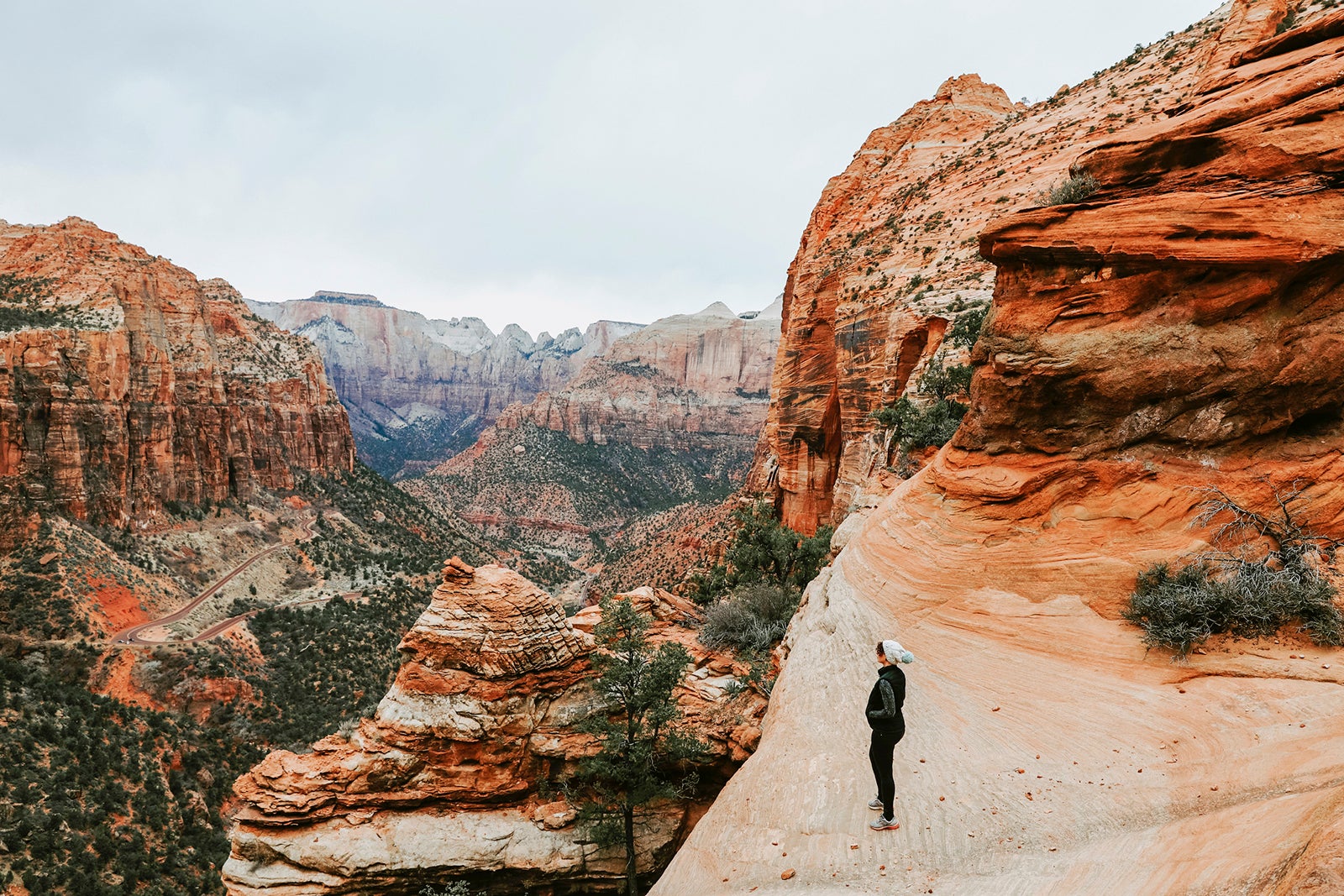 Full length of female hiker standing on rock formation at Zion National Park
