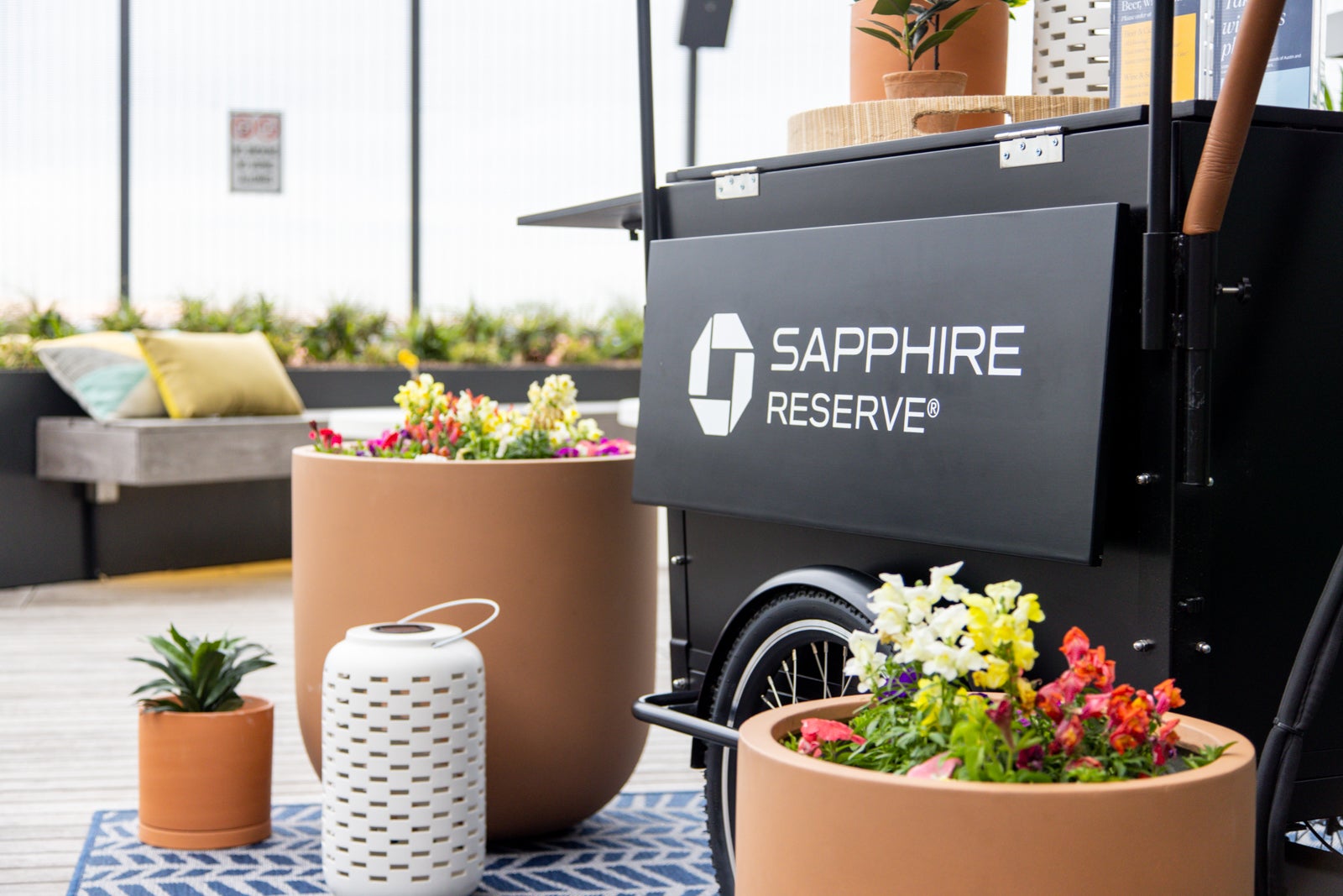 close-up of a drink cart with Chase Sapphire branding sits on an outdoor patio
