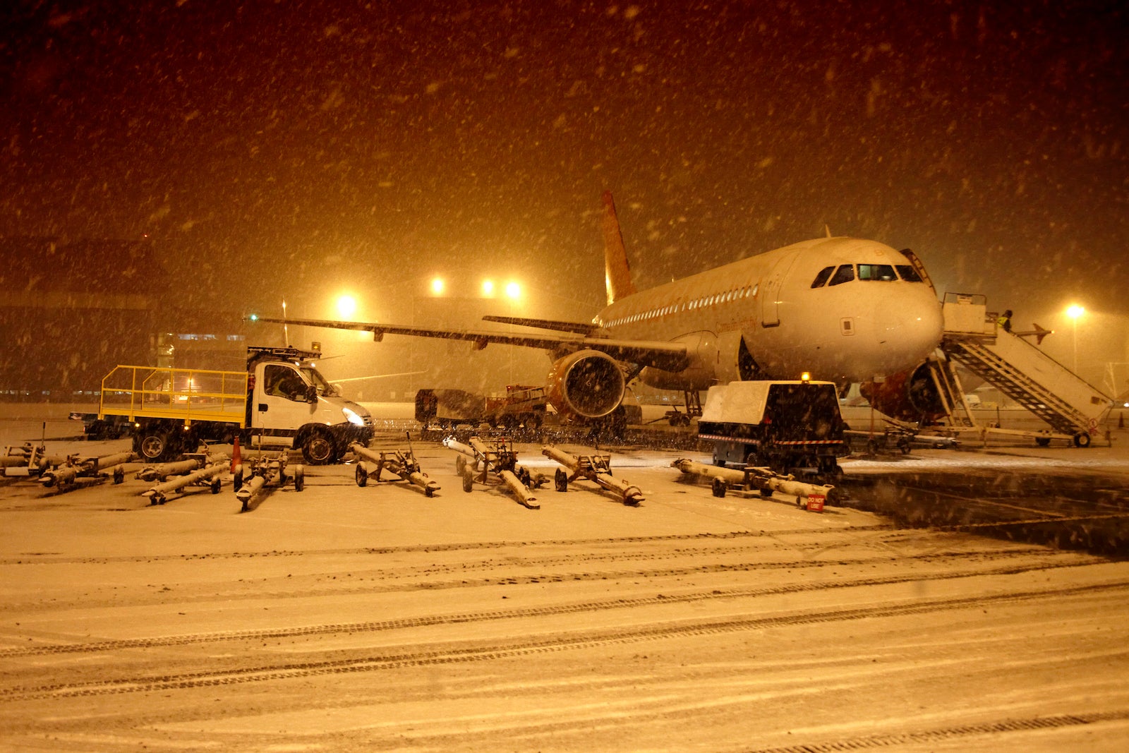 Plane in snow at an airport